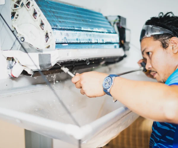 male-technician-cleaning-air-conditioner-indoors-2025-03-09-05-06-24-utc_20