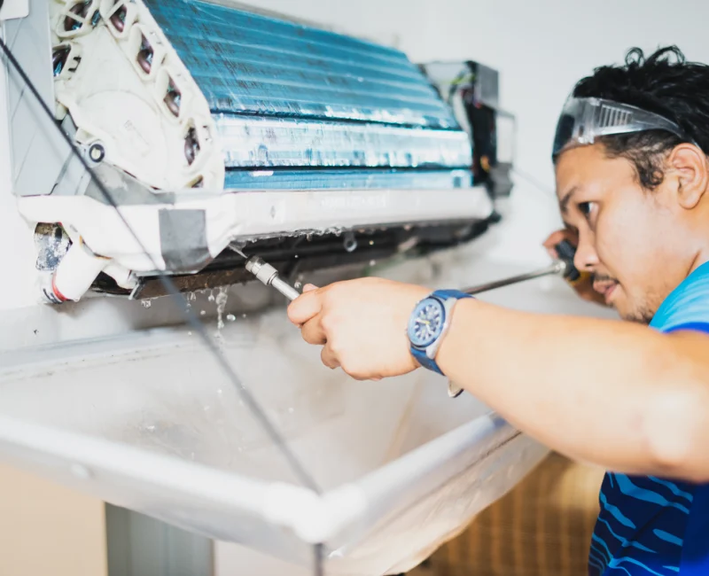 male-technician-cleaning-air-conditioner-indoors-2025-03-09-05-06-24-utc_20